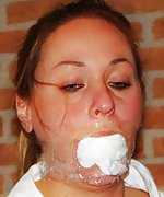 Busty beauty is roped, mouth-stuffed and tape-gagged