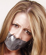 Beauty gets roped, tape-gagged and exposed